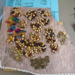 Beads and Coins used in a collage. Photo by Bronwyn Holmes.